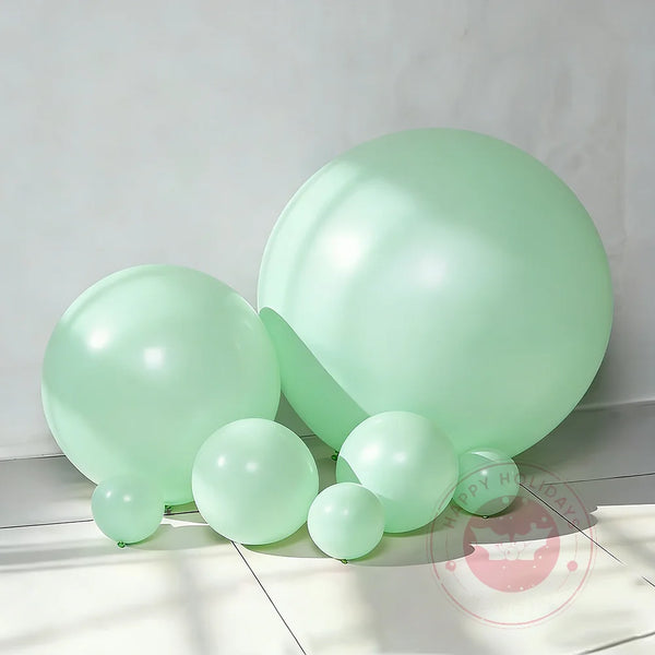A cluster of light mint green latex balloons used for party decoration.