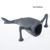 A dark gray 3D printed articulated sea monster fidget toy with a snout and tentacles.