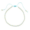 Handmade boho glass bead bracelet with adjustable cord featuring light blue and gold beads