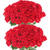 A dense bouquet of vibrant red artificial silk roses.
