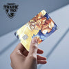 A hand holds a Dragon Ball Super Saiyan card skin sticker featuring Goku in a powerful pose.