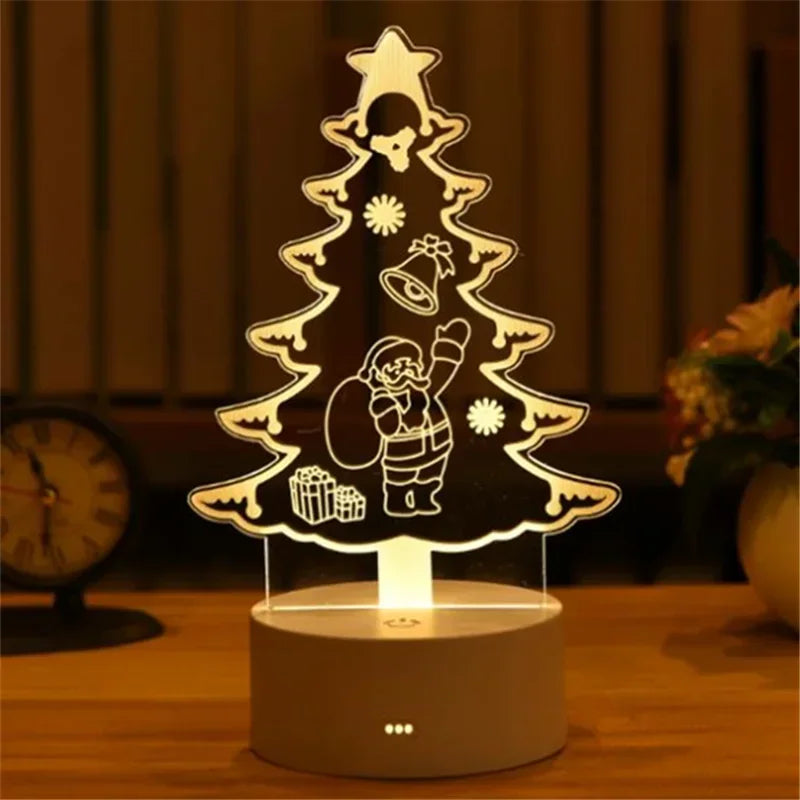 A glowing acrylic Christmas tree silhouette featuring a skull, bell, and star design on a wooden surface.