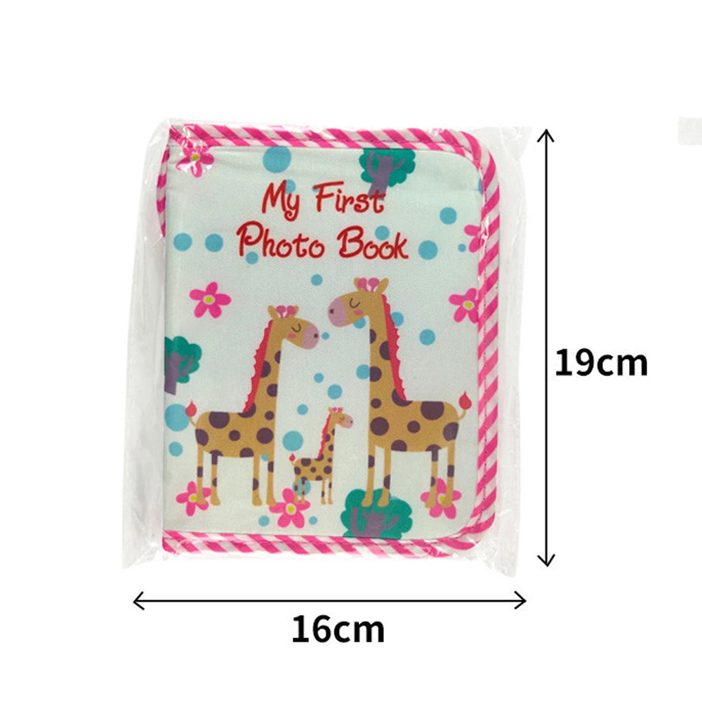 A pink and white photo book featuring two cartoon giraffes on a floral background.