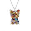 A colorful, iridescent acrylic pendant necklace featuring a Yorkshire Terrier charm.