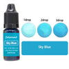 A bottle of Sky Blue liquid colorant with three dropper sizes showing different concentrations.