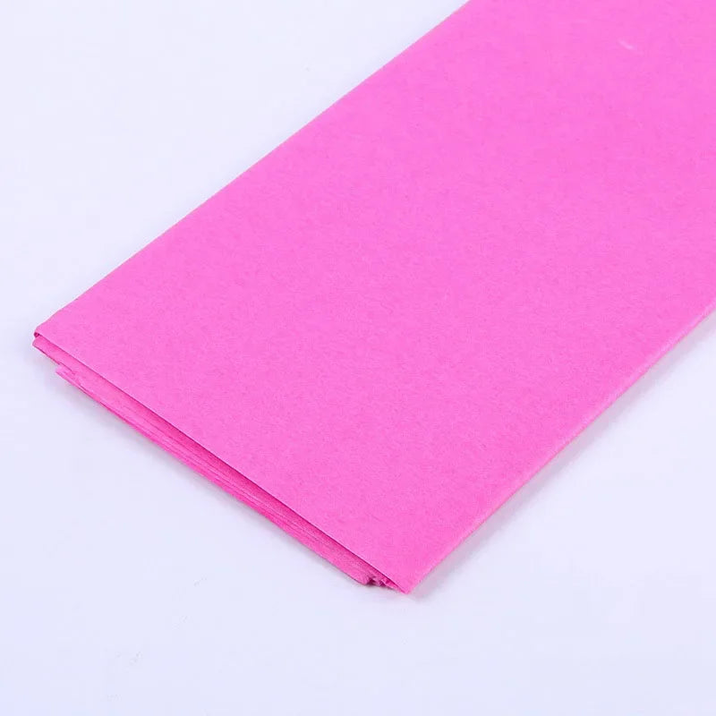 A sheet of bright pink soft tissue paper for gift wrapping and DIY crafts.