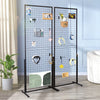 A black wire grid wall display rack featuring various small items and tools mounted on a transparent background.