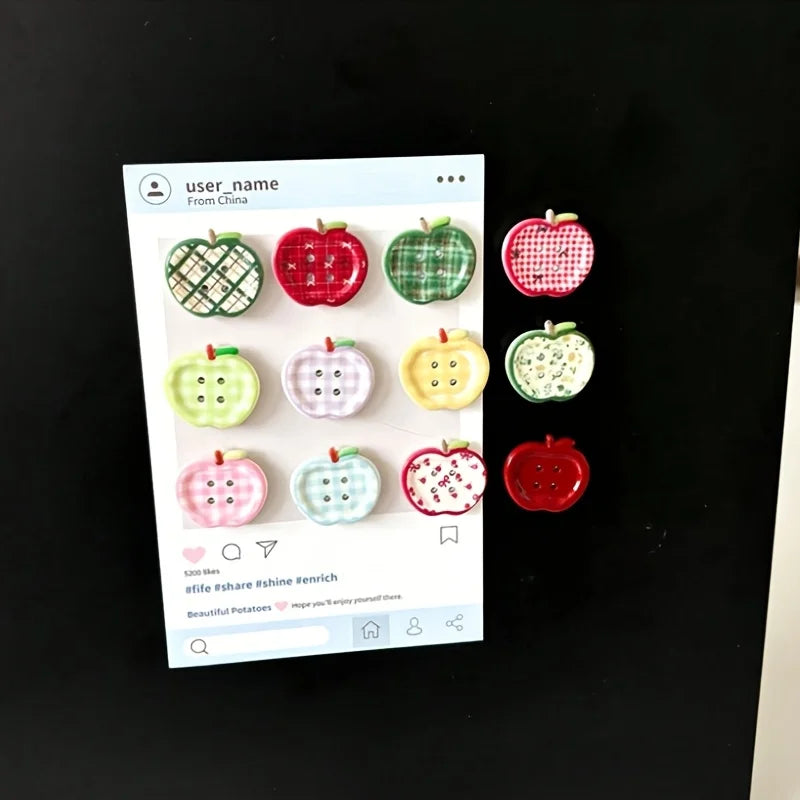 A collection of eight heart-shaped, checkered green and red fridge magnets displayed on a white background.