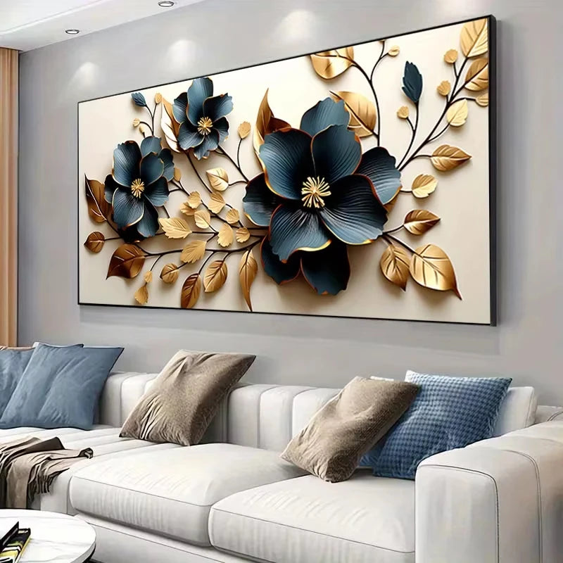 A modern canvas art print featuring golden and blue floral branches on a light gray wall above a white sofa.