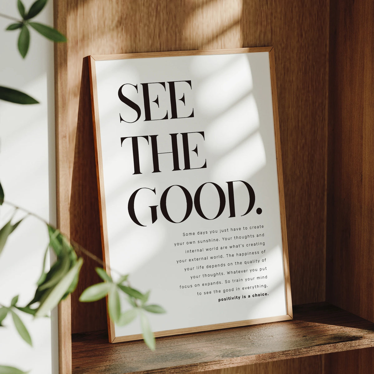 A framed inspirational quote canvas wall art poster with black text on a white background set in a wooden frame.