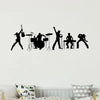 Black silhouette decals of a musical band performing on stage