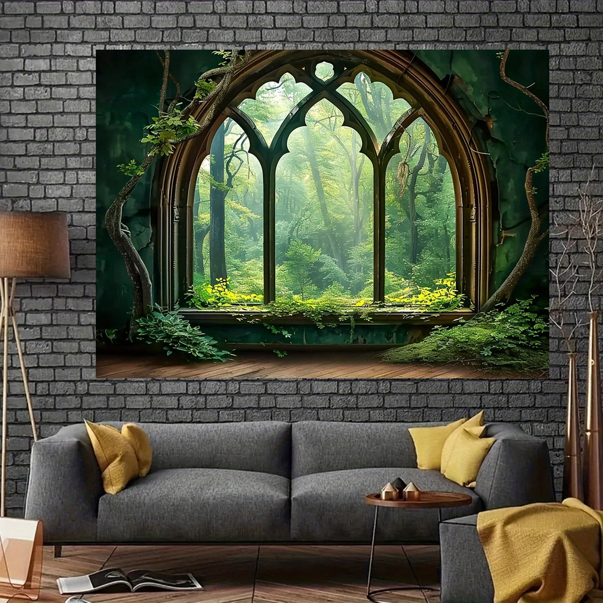 A modern gray sofa is placed in front of a large framed painting depicting an arched window view of a lush green forest.