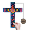 A colorful wooden cross wall art piece decorated with vibrant flowers and flames, hanging from a cord.