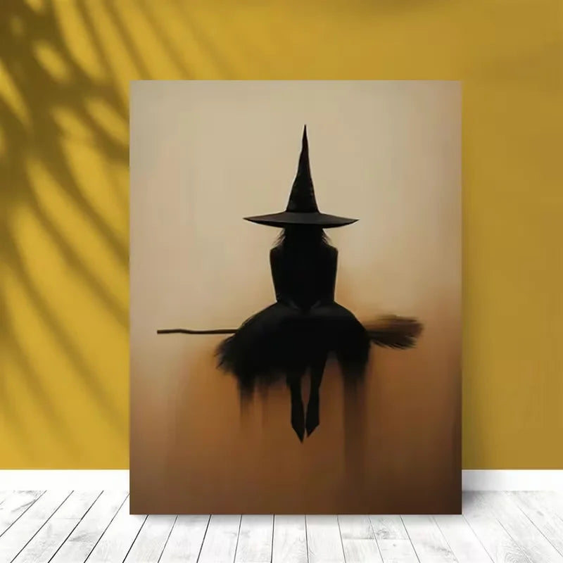 Minimalist witch silhouette wall art featuring a black witch on a broomstick against a soft, warm background.