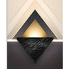 Modern geometric wall art featuring layered triangles in gold, black, and cream tones.