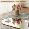 A full length body mirror with an aluminum frame reflecting a floral arrangement.