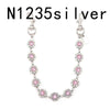 Silver necklace with pink rhinestones and a vintage bag chain extender.