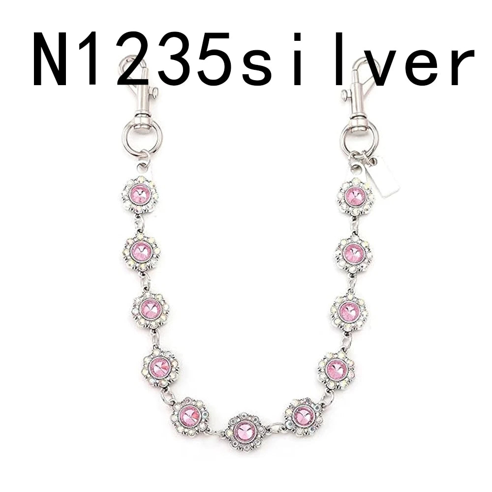 Silver necklace with pink rhinestones and a vintage bag chain extender.