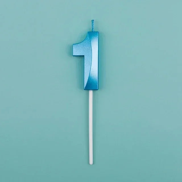 A blue number one candle with a white stick against a light teal background.