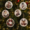 Christmas diamond painting ornaments featuring Santa, a snowman, and reindeer designs hanging on a green fir tree