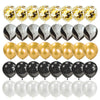 A set of elegant black and gold disposable dinnerware including balloons, plates, and cups for parties.