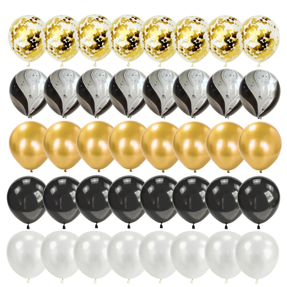 A set of elegant black and gold disposable dinnerware including balloons, plates, and cups for parties.