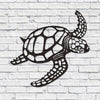 Black silhouette of a sea turtle on a white brick background.
