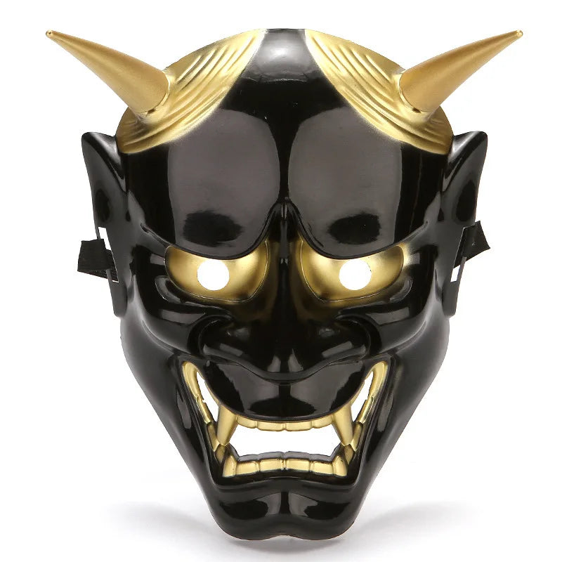 A full face Japanese Hannya demon mask with black skin, golden horns, and an open mouth.