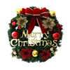 A 10-inch artificial Christmas wreath decorated with red berries and a large red velvet bow.