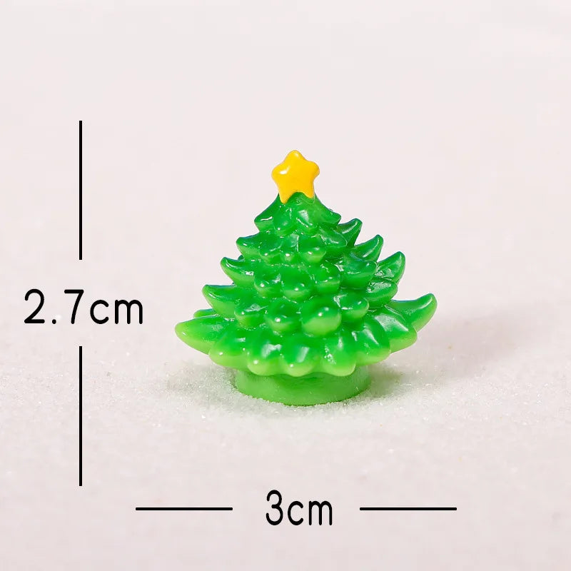 A small, bright green resin Christmas tree charm with a yellow star topper, shown against a white background.