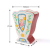 A pink ceramic vase shaped like a bird, decorated with floral patterns and blue accents.