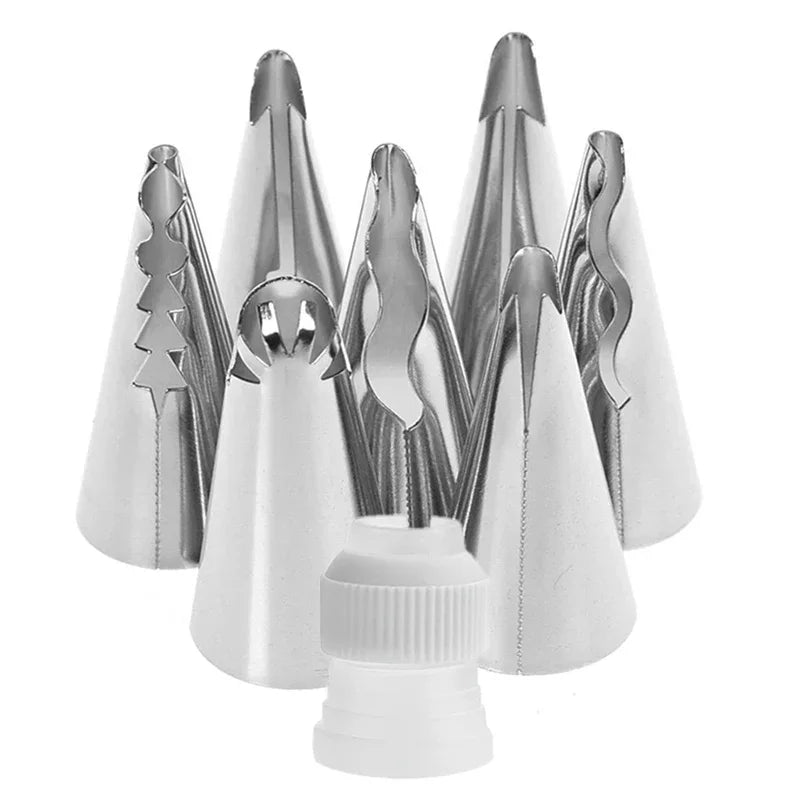 A set of silver Russian piping tips for cake decorating, shown in various angles.