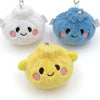 Three plush butter dumpling squishy keychains in white, blue, and yellow with cute faces