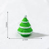 A small, green, conical Christmas tree charm with white frosting details, shown against a white background.