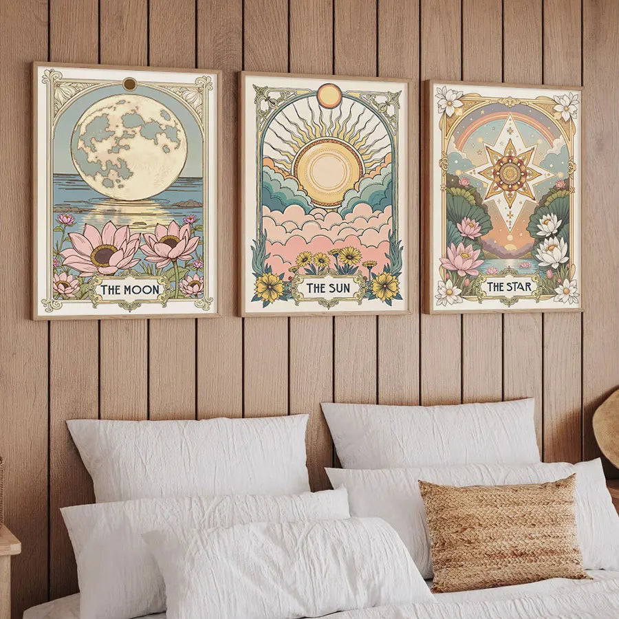 A set of three framed celestial tarot art prints featuring the moon sun and star with floral designs.
