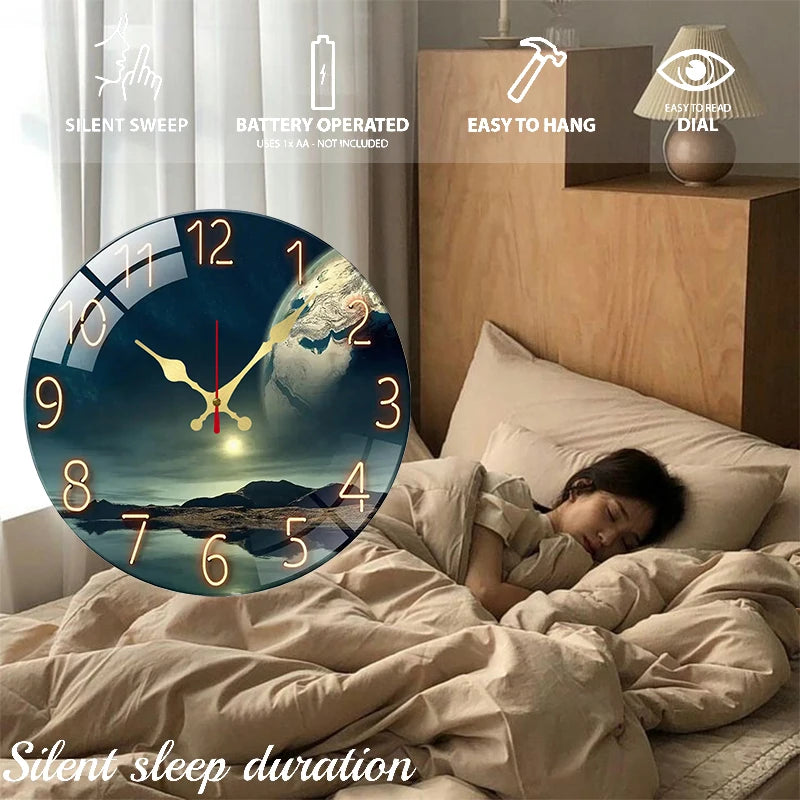 A round wall clock with an Earth landscape design is displayed on a wooden bedside table next to a person sleeping in bed.