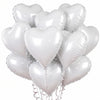 A bunch of white heart-shaped foil balloons tied together on a string.