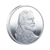 A silver commemorative metal coin featuring a profile portrait of Jesus Christ.