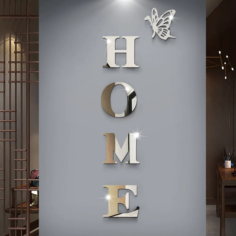 A set of self-adhesive acrylic butterfly mirror wall stickers spelling out the word HOME