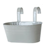 A modern boho metal hanging planter with a wide basin and two curved hangers.