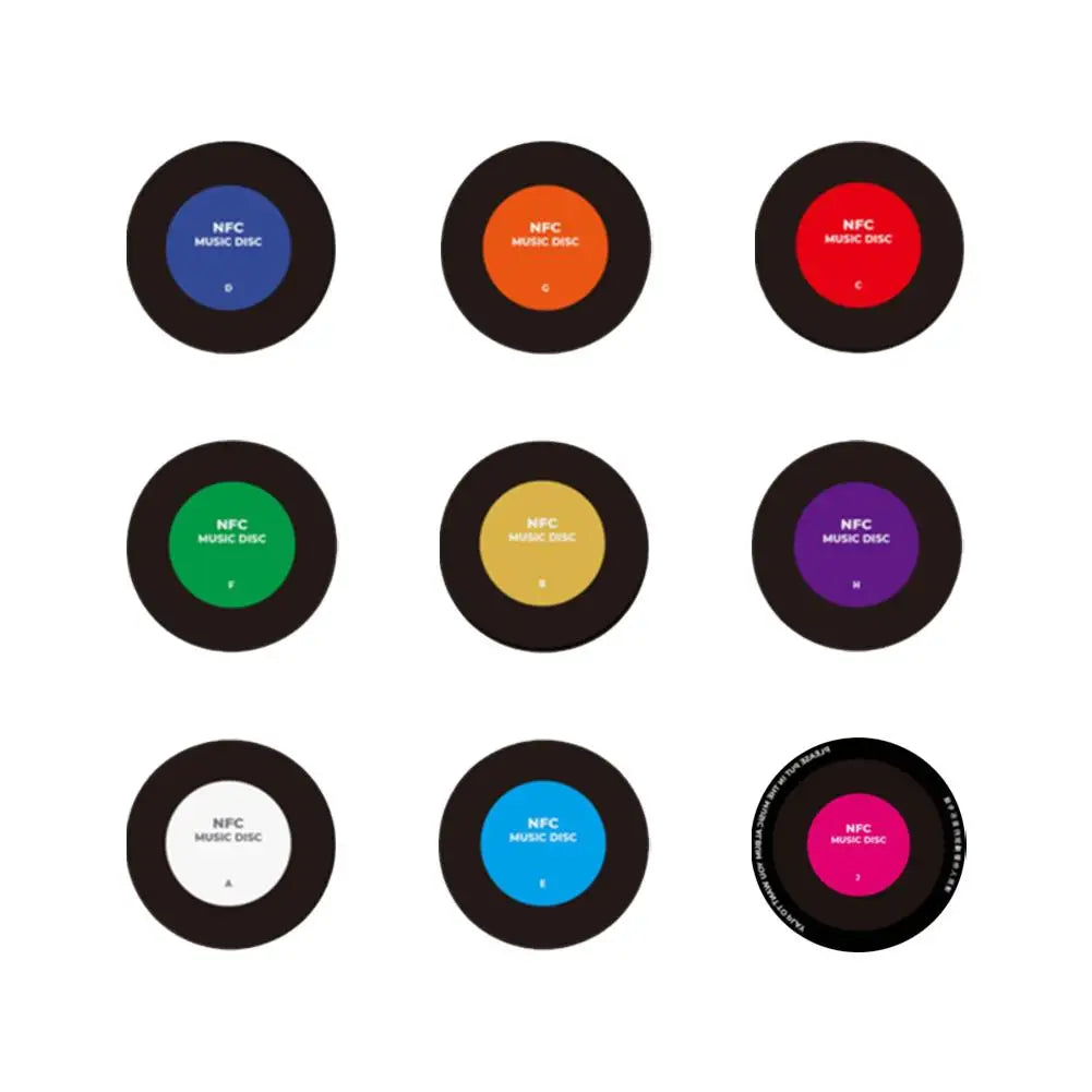 A set of nine magnetic vinyl record night lights in various colors and designs.