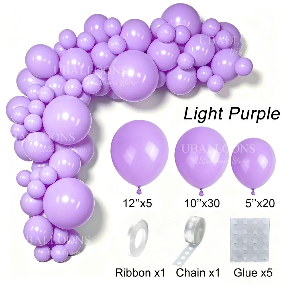 A collection of light purple latex balloons, ribbons, chains, and glue for party decor.