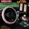 A set of six leopard print car accessories including a steering wheel cover, shoulder pads, and a handbrake gear cover.