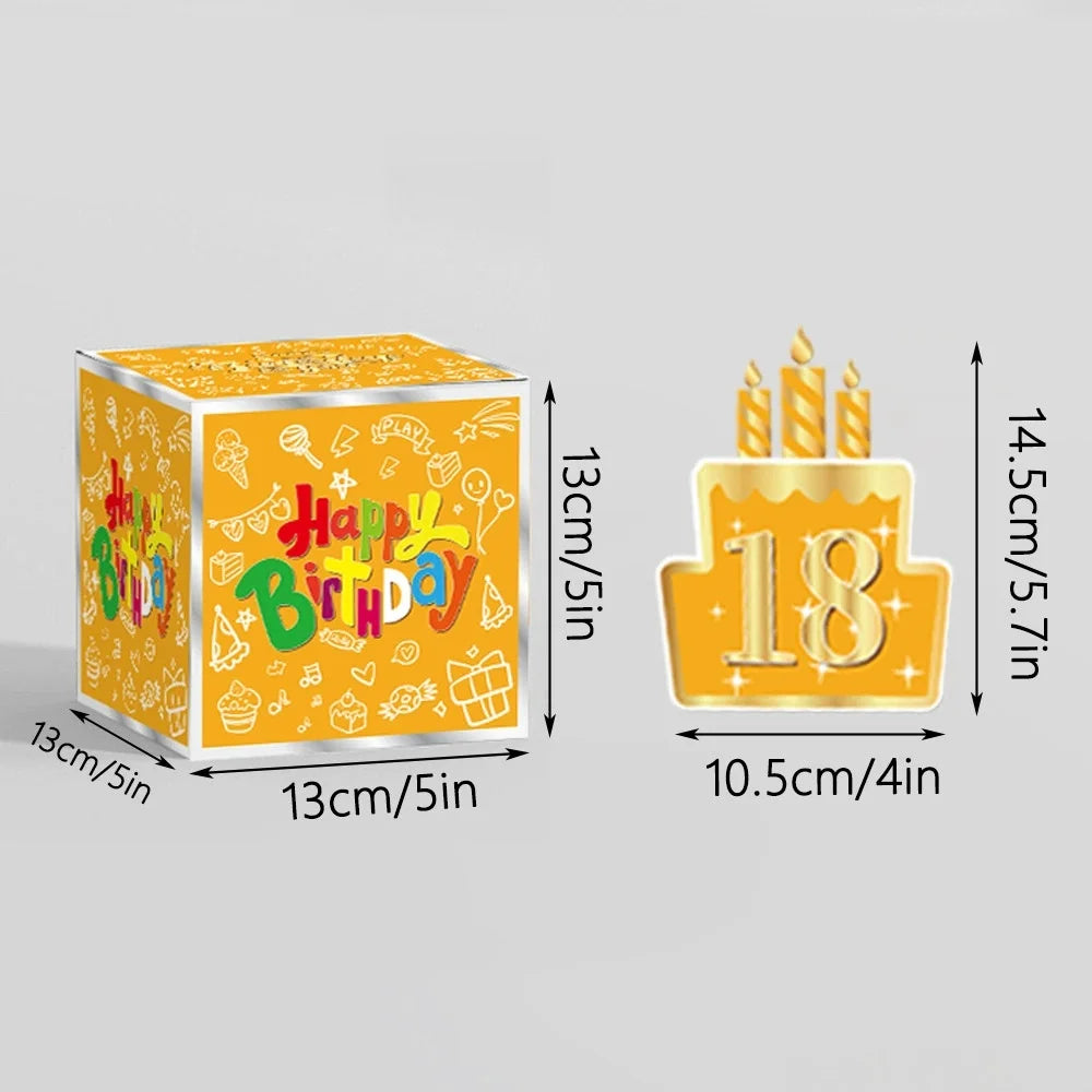A yellow birthday gift box with a number 18 on top and lit candles.