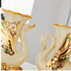 Gold ceramic swan vase for tabletop decor featuring gold and white tones