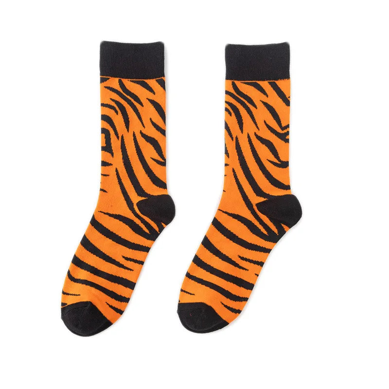 A pair of orange and black tiger print crew socks.