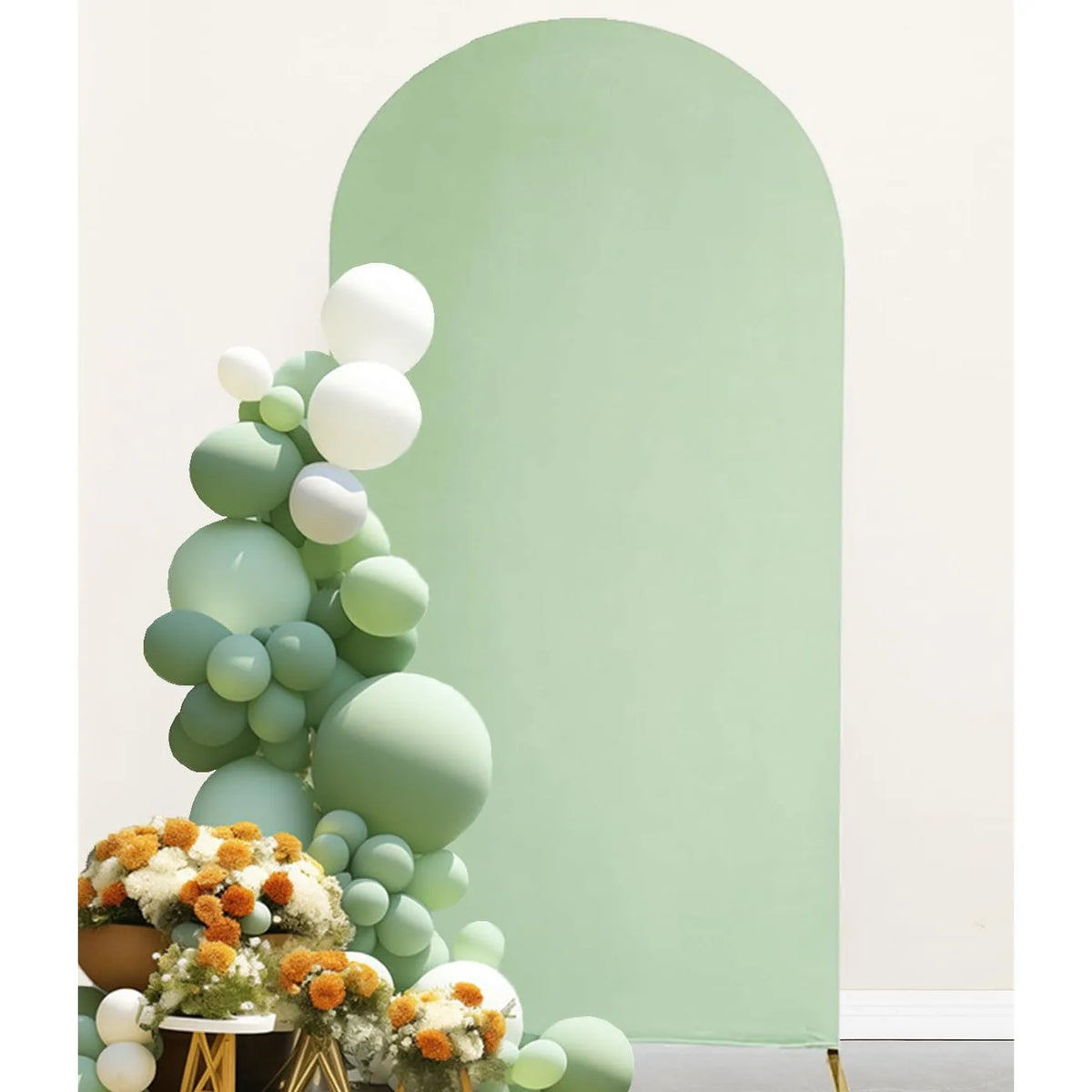 A floral and spherical green arch backdrop cover decorated with white and light green balloons.