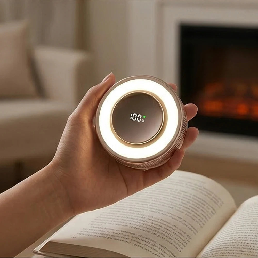 A hand holds a round, illuminated magnetic bladeless handheld fan with a digital display.