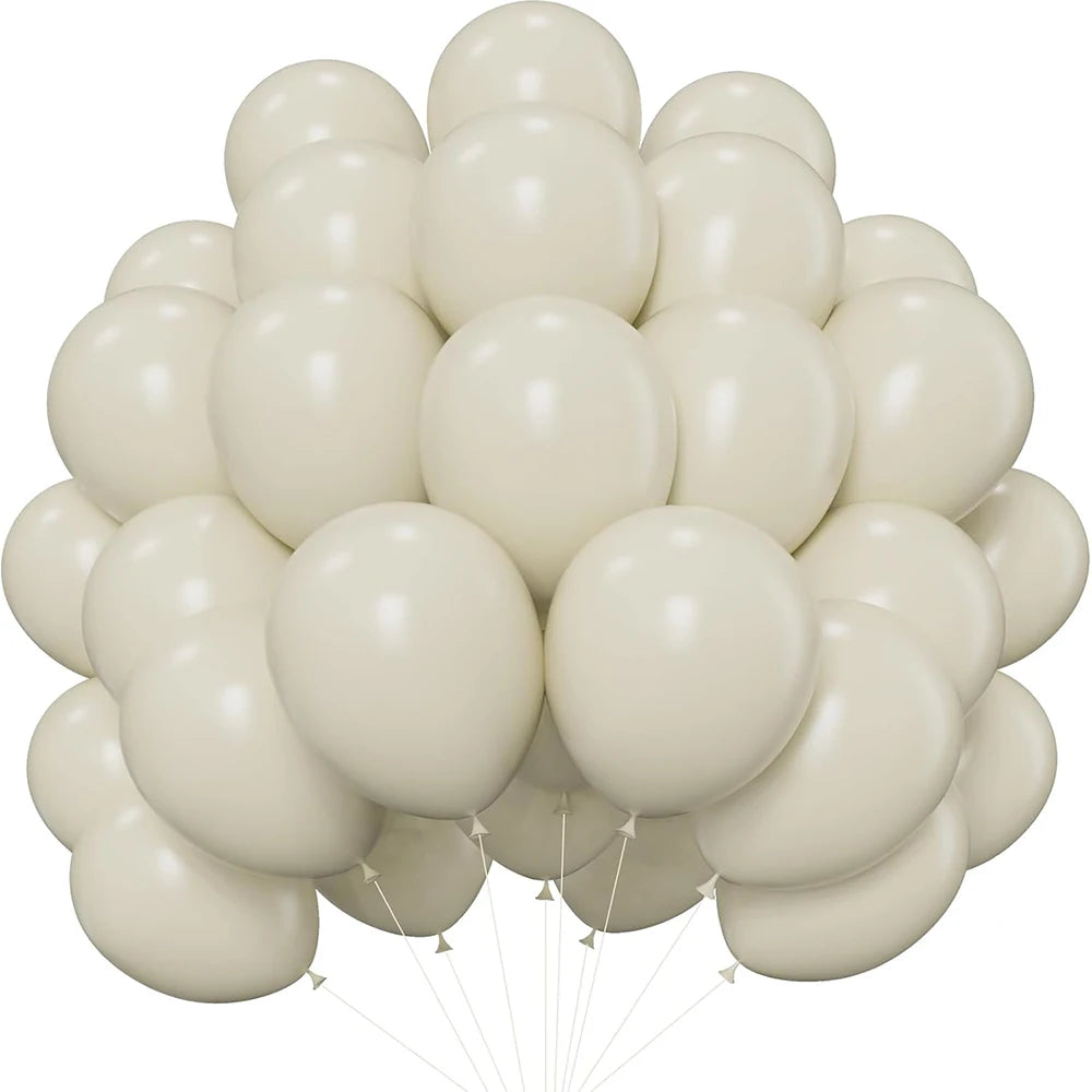A bunch of white latex balloons tied together, ready for a party.