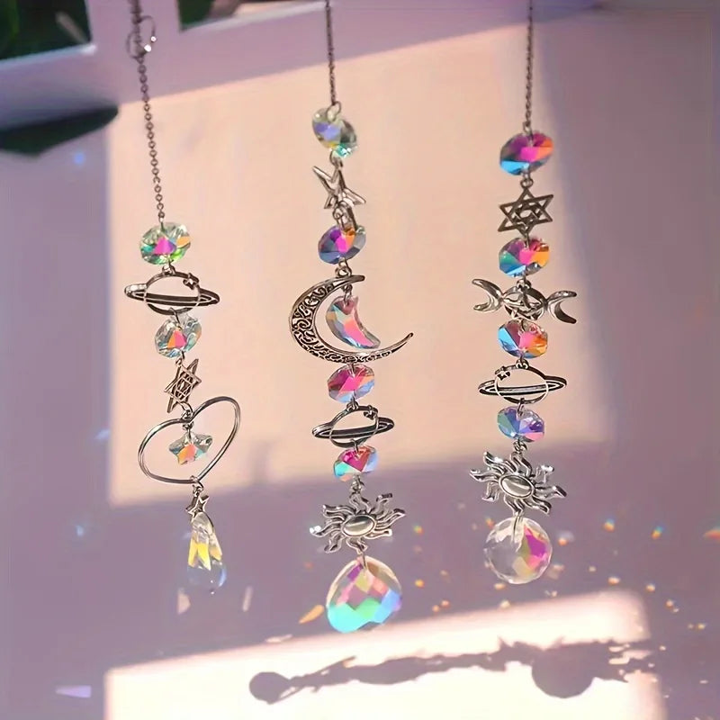 A set of crystal moon and sun wind chimes featuring various celestial shapes and iridescent beads.